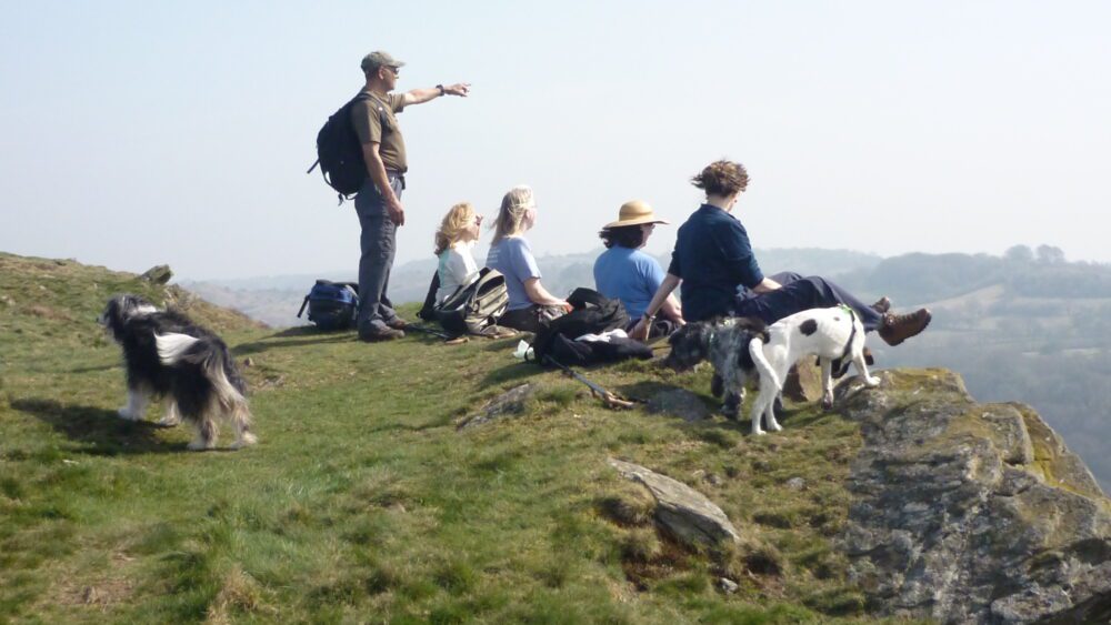 Walkers at the top of the Garth enjoying the view